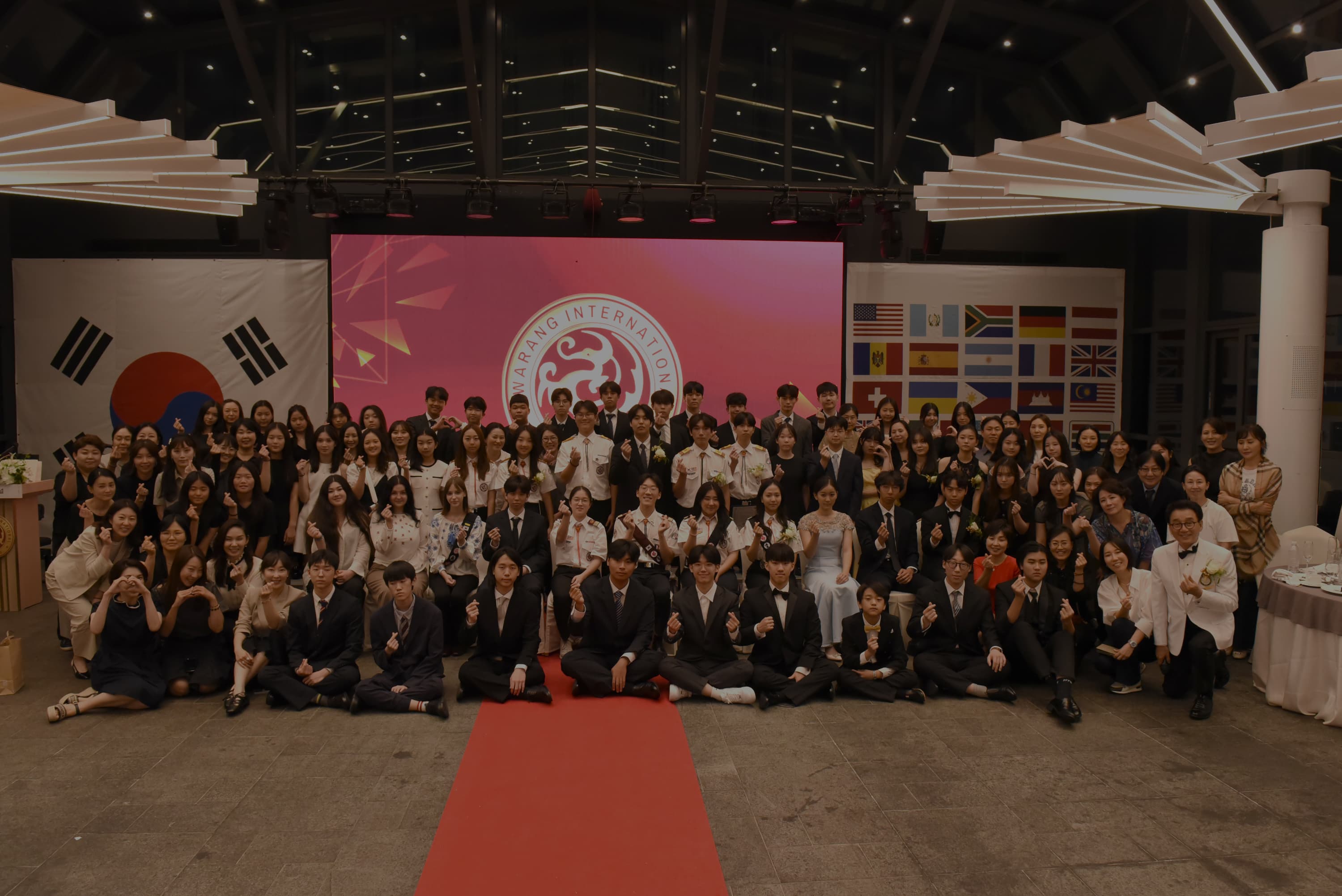 Large annual group photo with parents and members at a formal event
